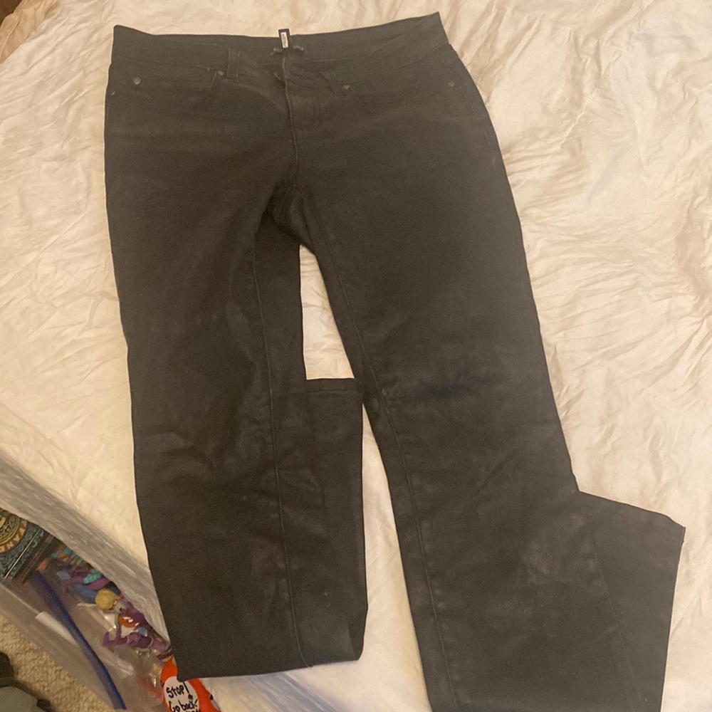 Size 6, black shiny Ellen Fisher pants somewheres which is normal for her age